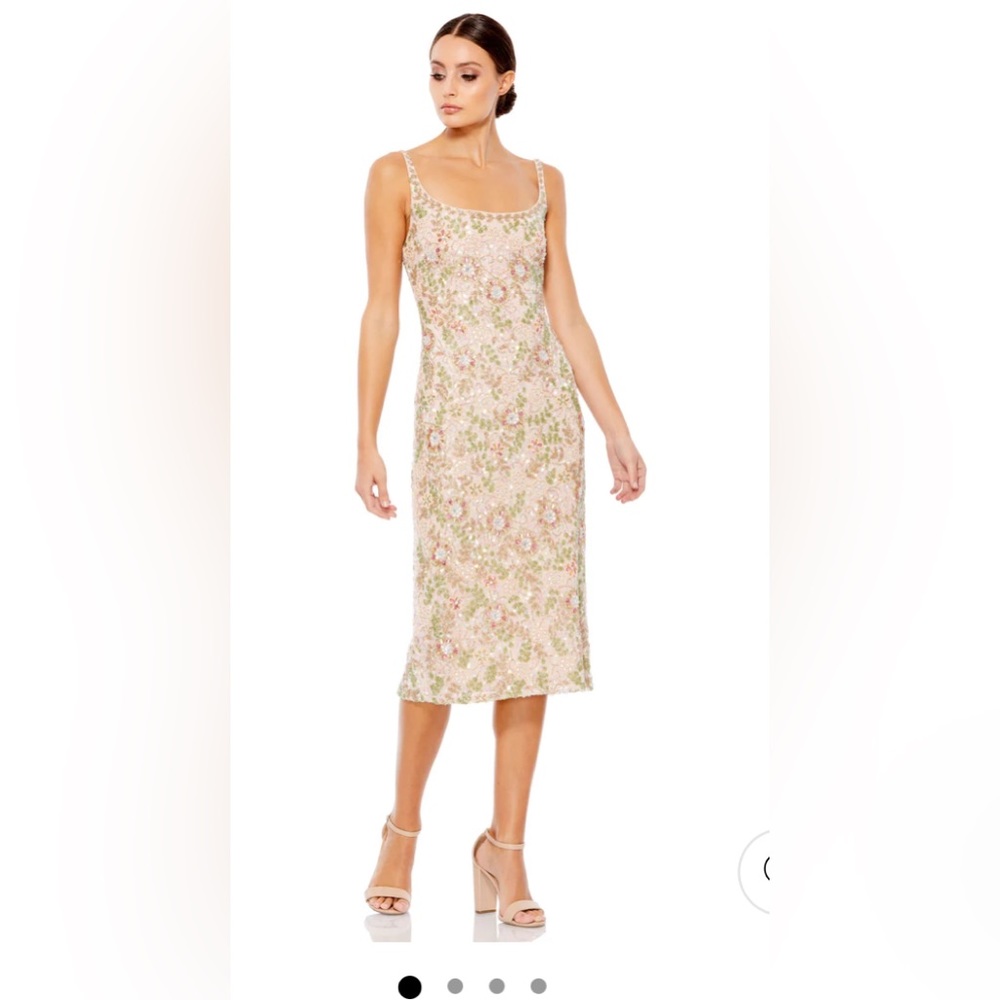 Elegant fully beaded floral midi cocktail dress with a scoop back and back slit.